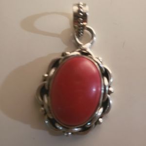 Silver and coral pendant